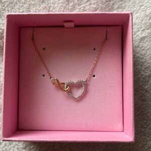 rose gold Swarovski necklace. infinity sign with diamond heart.
